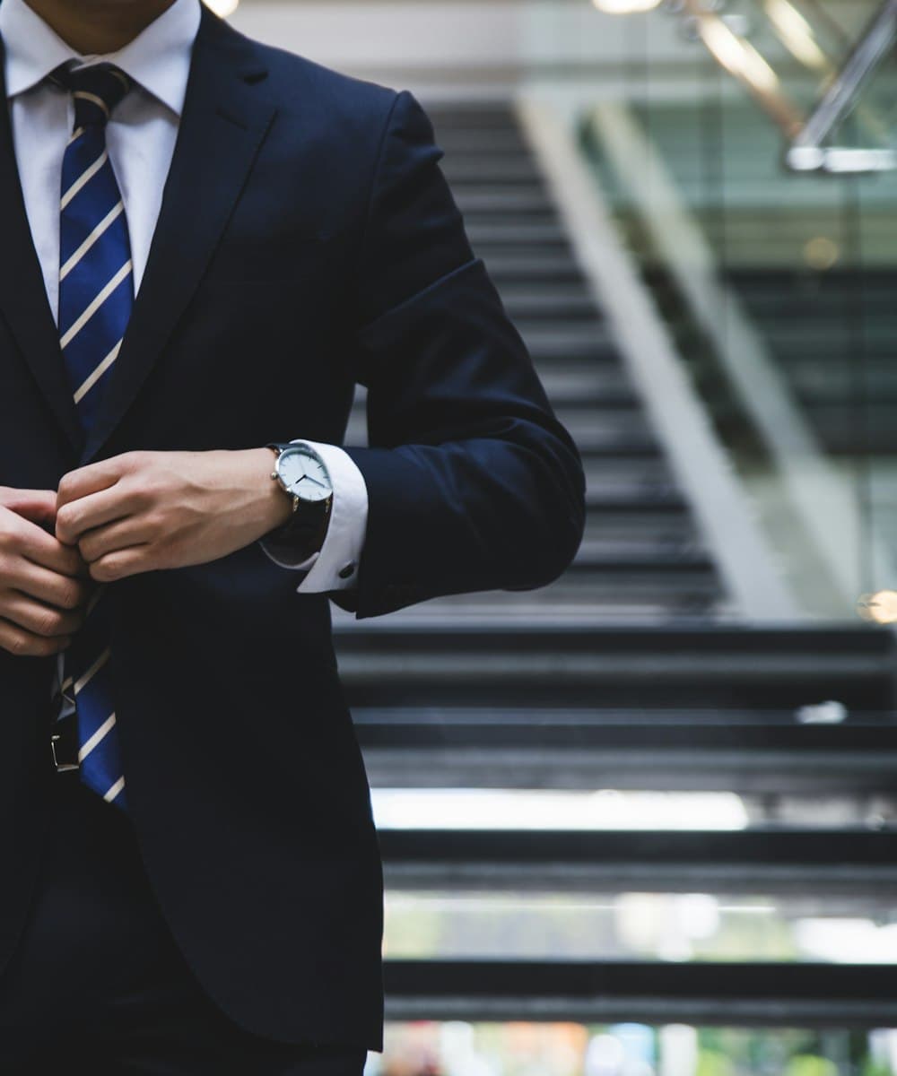 Sales professional in a suit on the way to a customer meeting
