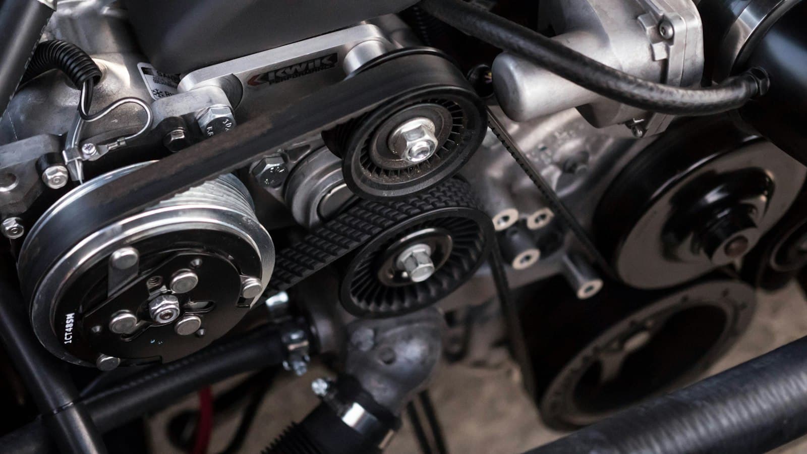 Close-up of a car engine with belt drive and pulleys
